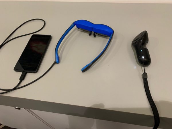 An Nreal AR headset with a smartphone attached via USB-C